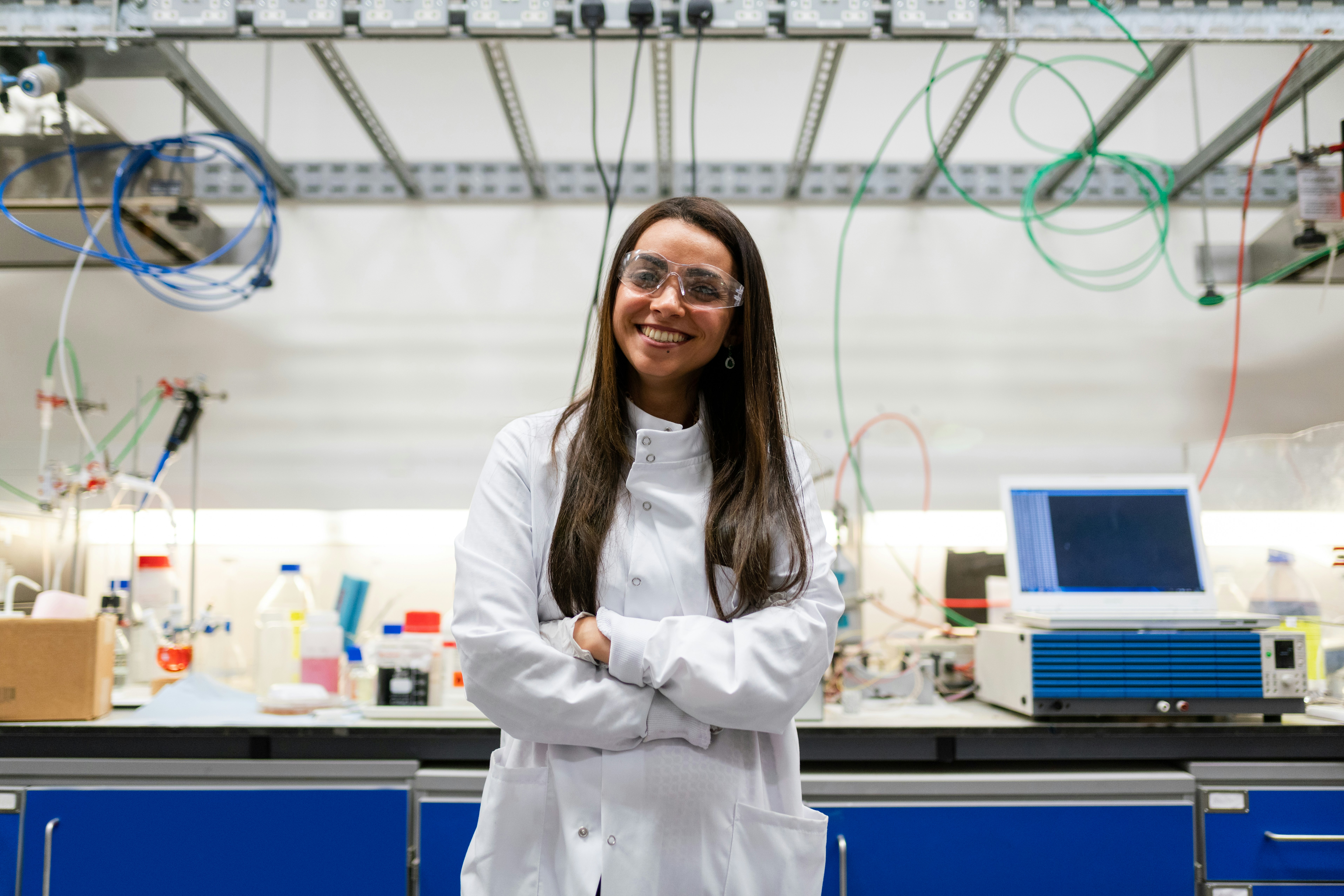 woman in white coat smiling